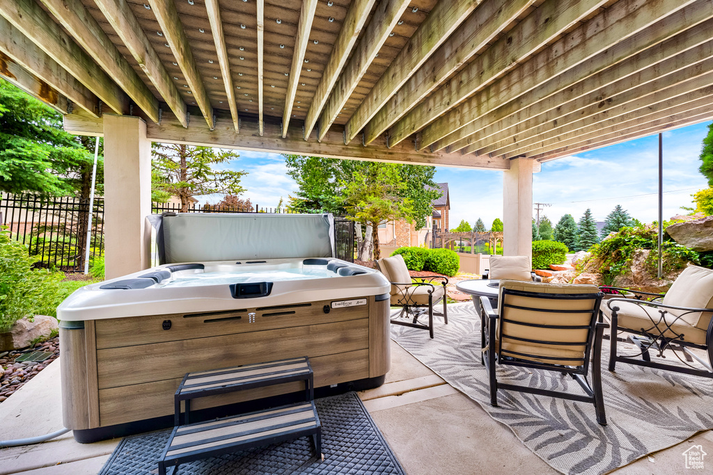 View of patio / terrace featuring a hot tub