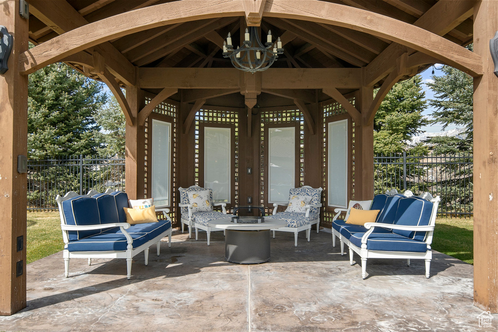 View of patio featuring an outdoor living space and a gazebo