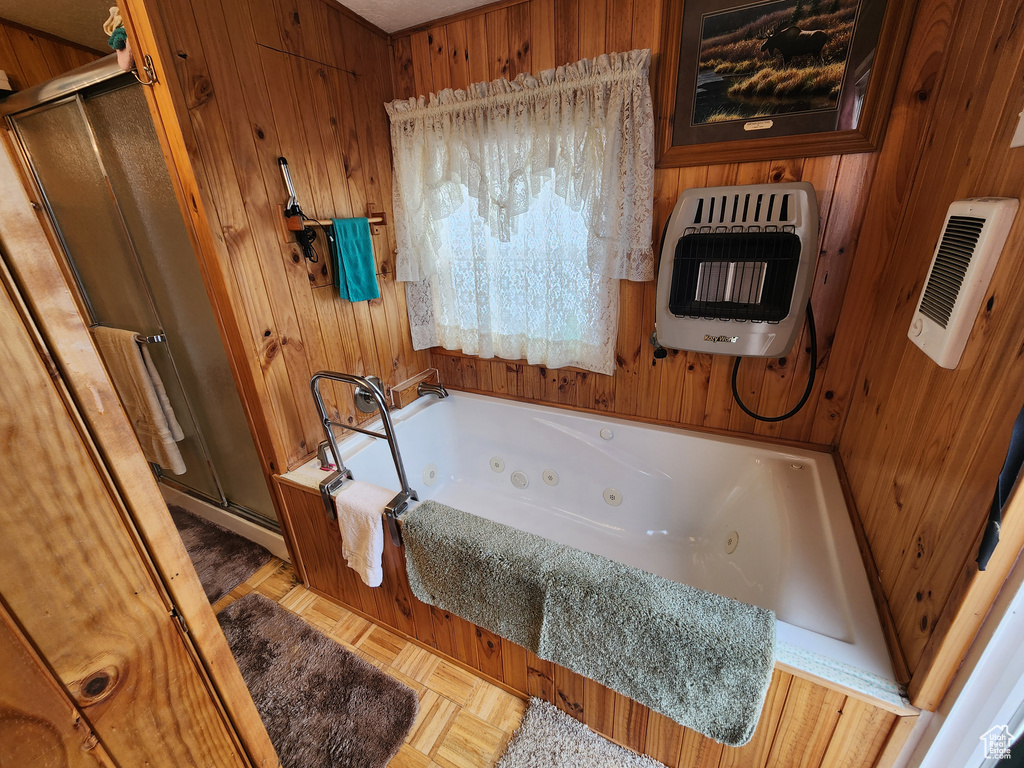 Bathroom with an enclosed shower and wooden walls