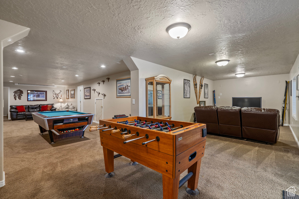 Recreation room with billiards, carpet floors, and a textured ceiling