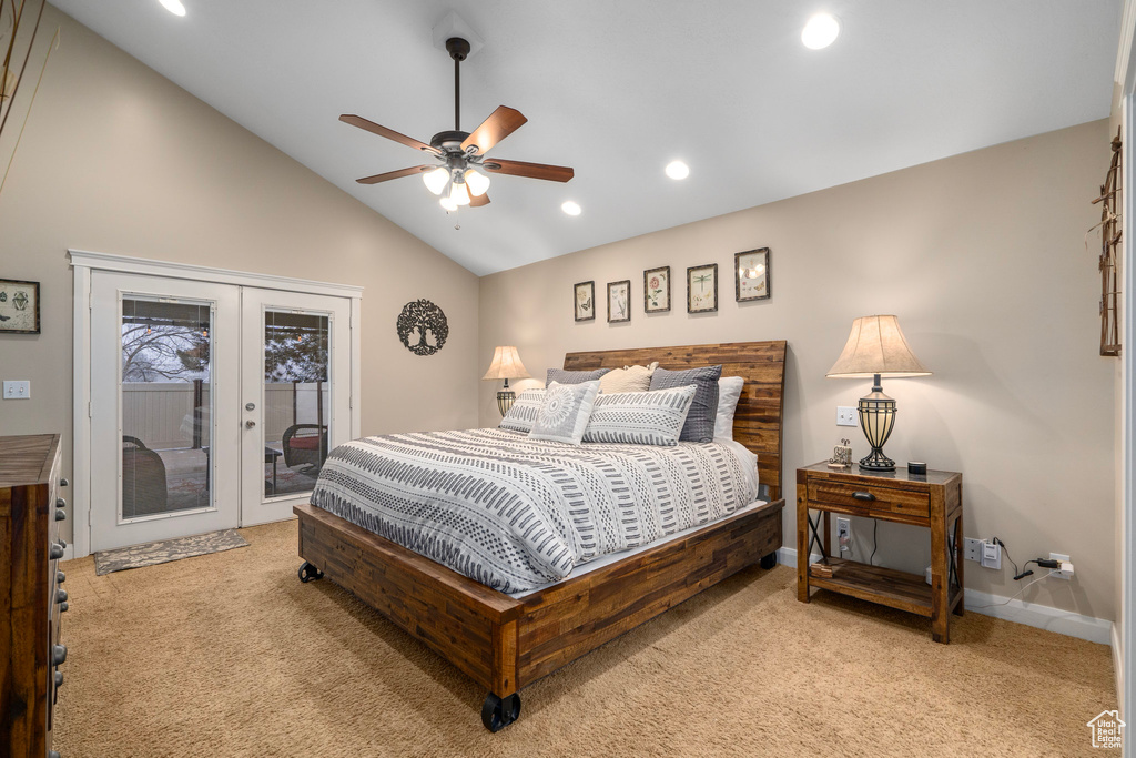 Bedroom with light colored carpet, french doors, access to outside, and ceiling fan