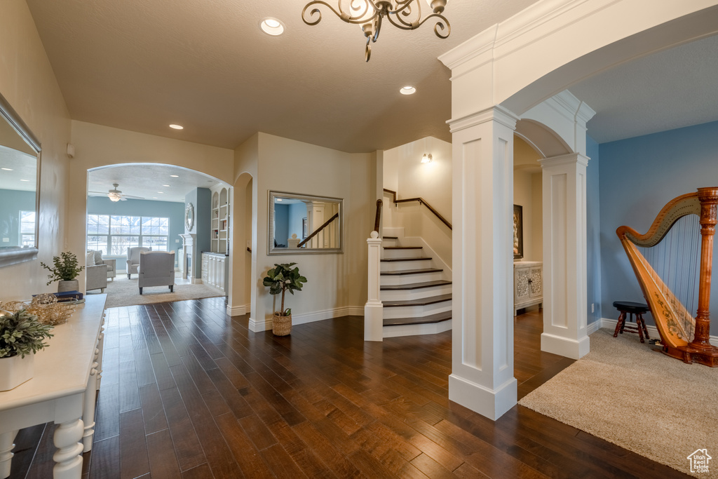 Interior space with decorative columns and ceiling fan