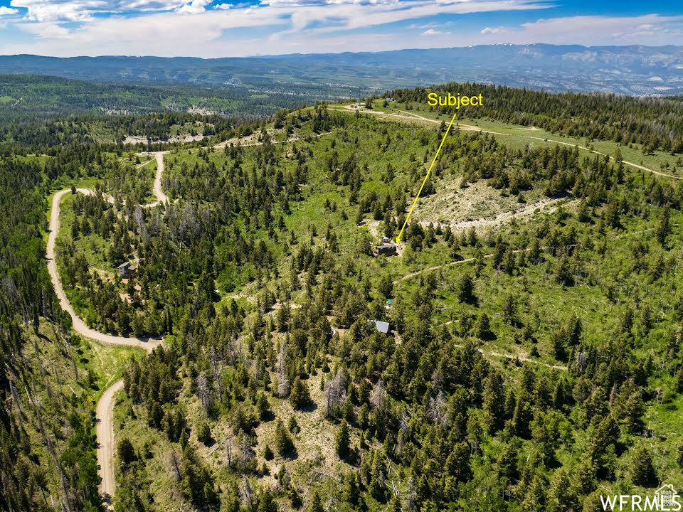 Birds eye view of property featuring a mountain view