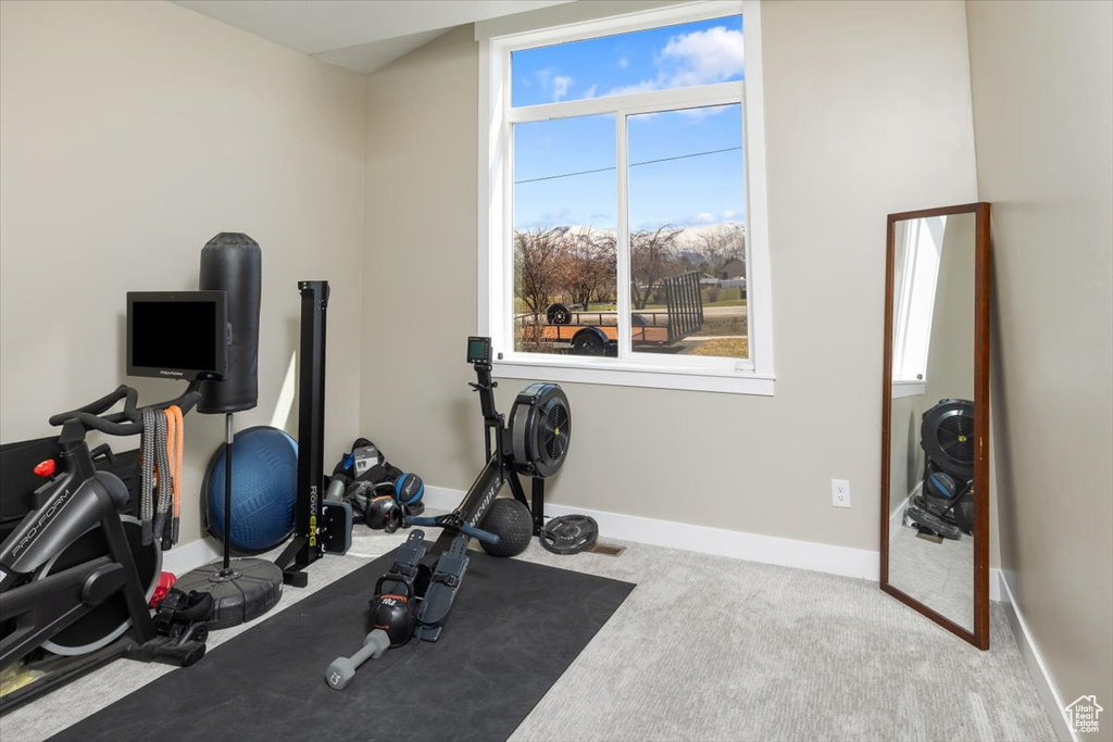 Exercise room with light carpet