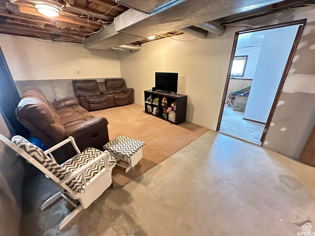 Living room featuring concrete floors