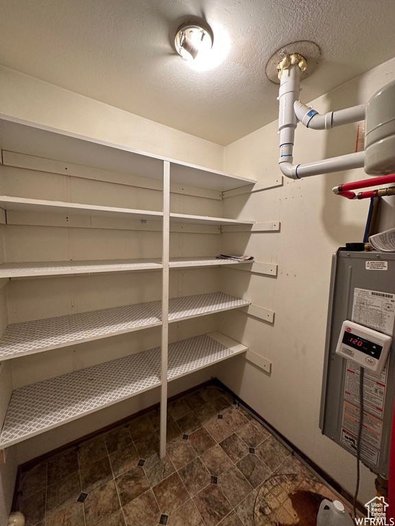 Pantry featuring water heater