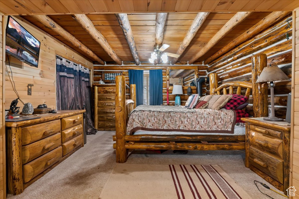 Bedroom featuring wood ceiling and carpet