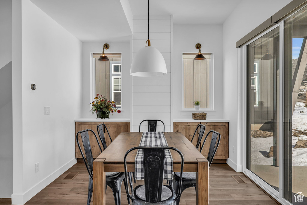Dining room with dark wood-type flooring
