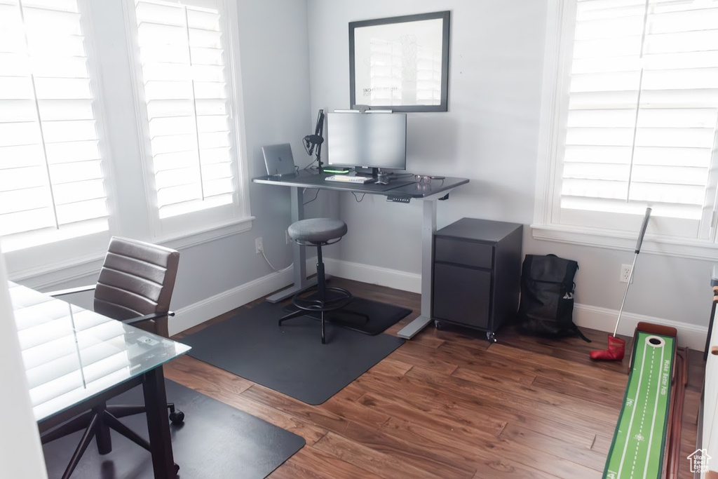 Office area featuring dark wood-type flooring