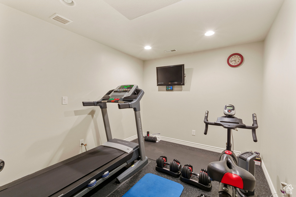 Workout room featuring carpet flooring