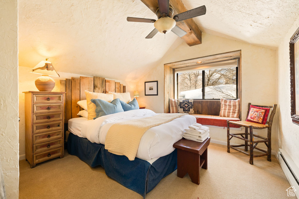 Bedroom with light carpet, vaulted ceiling with beams, a textured ceiling, and baseboard heating