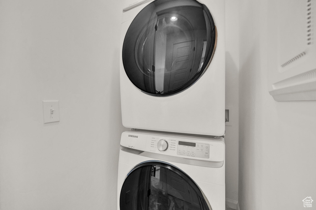 Laundry area featuring stacked washer / dryer