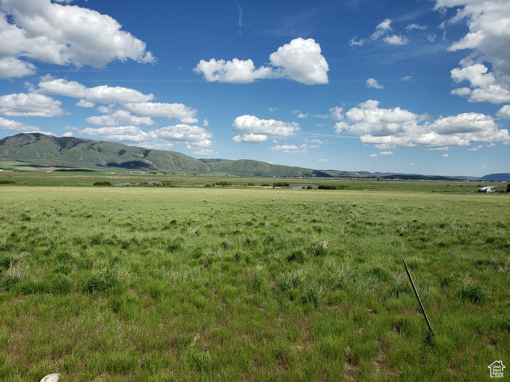 Property view of mountains with a rural view