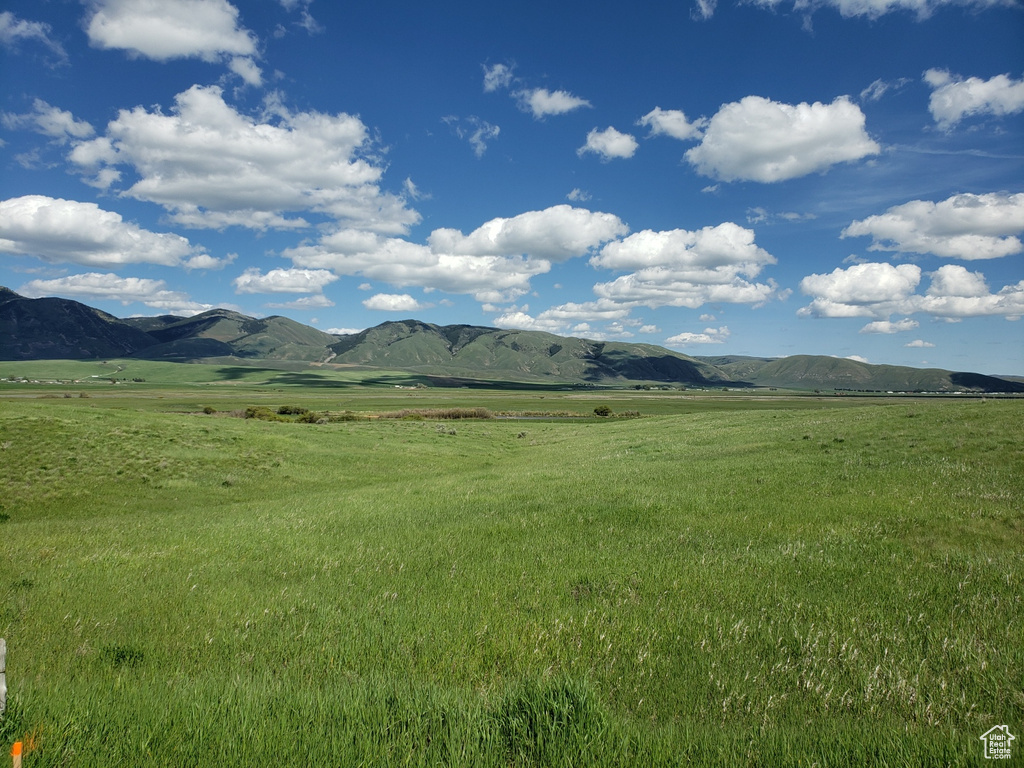 Property view of mountains with a rural view