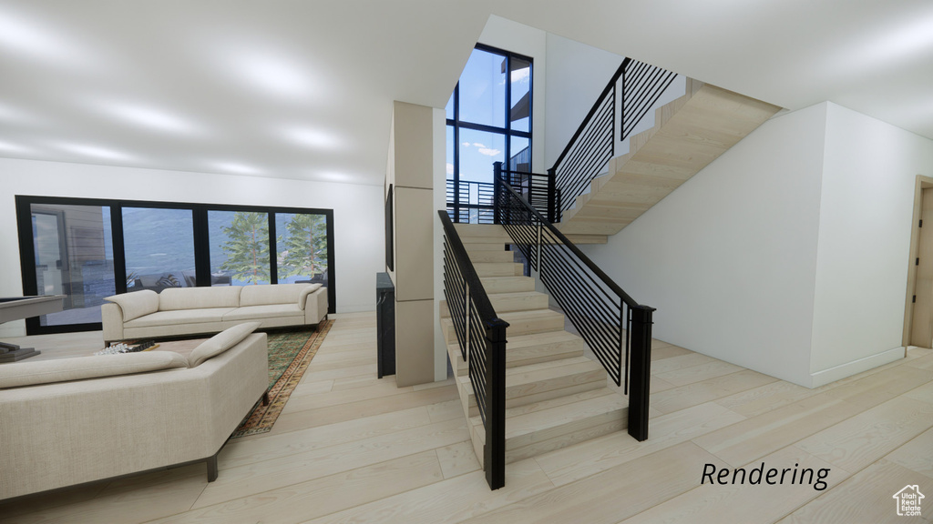 Staircase featuring light hardwood / wood-style flooring