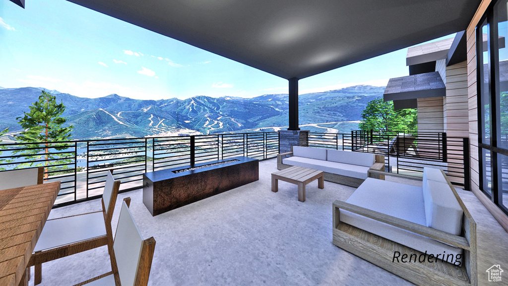 View of patio with a balcony and a mountain view