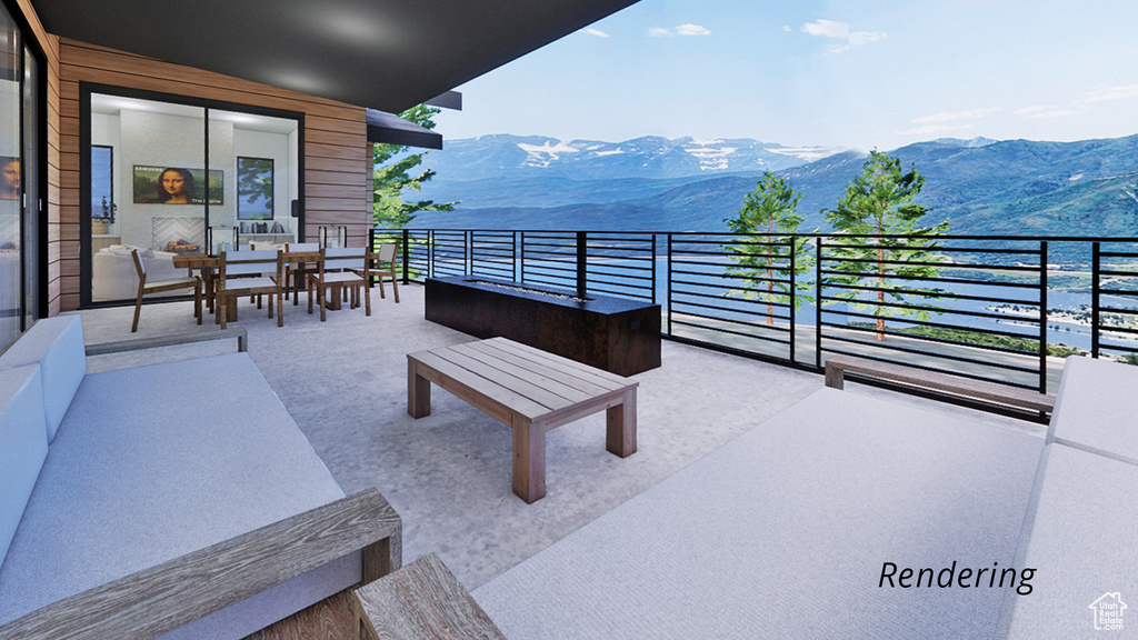 View of patio featuring a mountain view and a balcony