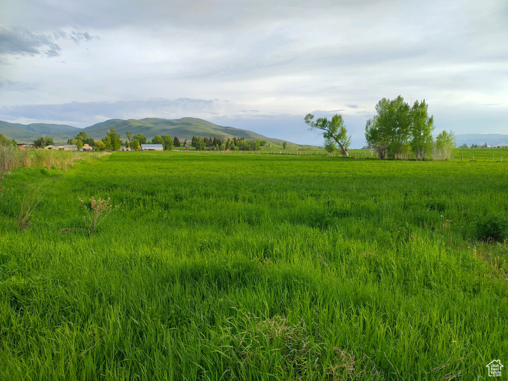 Property view of mountains with a rural view