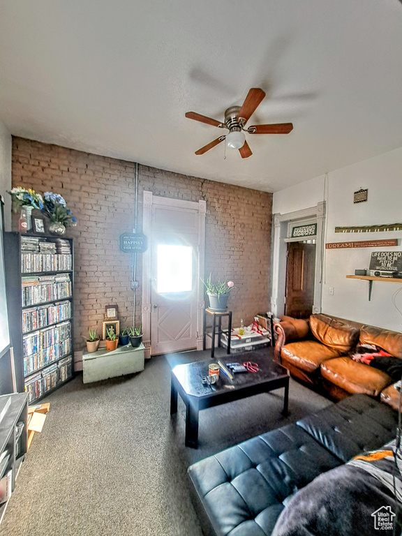 Living room with brick wall and ceiling fan
