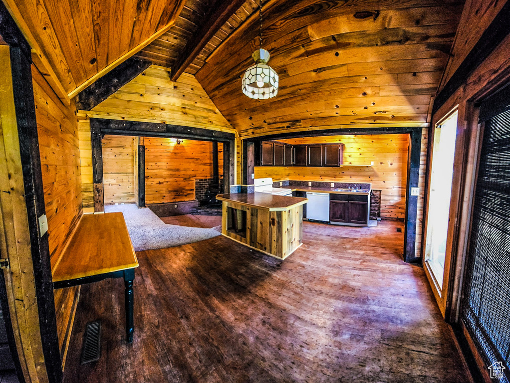 Kitchen featuring lofted ceiling with beams, wooden walls, dark hardwood / wood-style flooring, and wooden ceiling