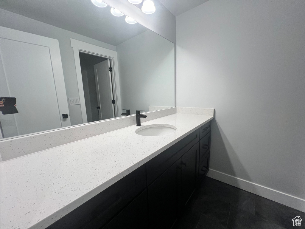 Bathroom with tile flooring and oversized vanity