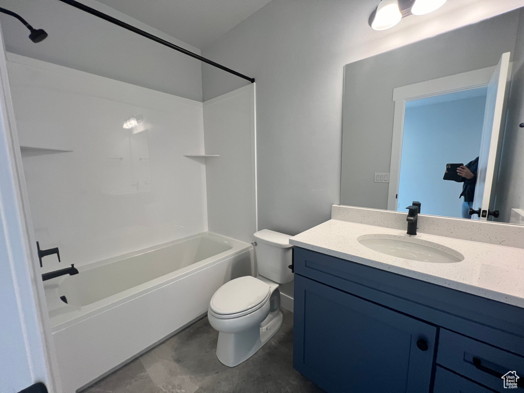 Full bathroom with toilet, bathtub / shower combination, tile flooring, and vanity