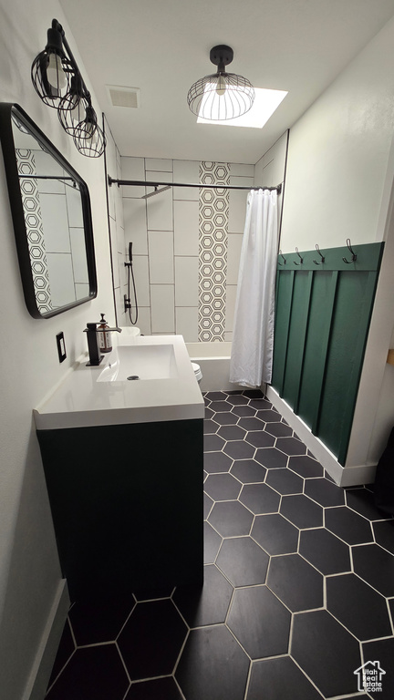 Bathroom with vanity and tile flooring