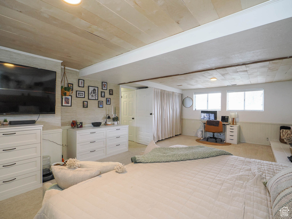 Carpeted bedroom featuring wood ceiling