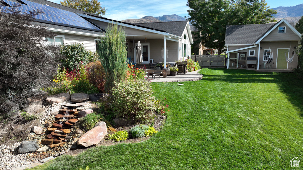 View of yard featuring a patio area and a mountain view
