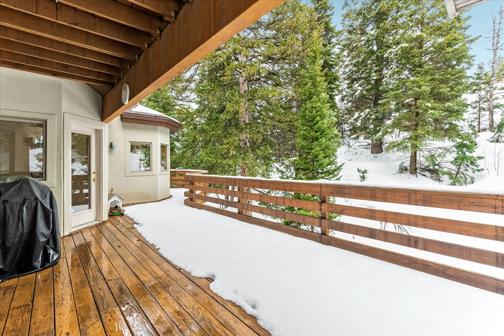 Snow covered deck with grilling area