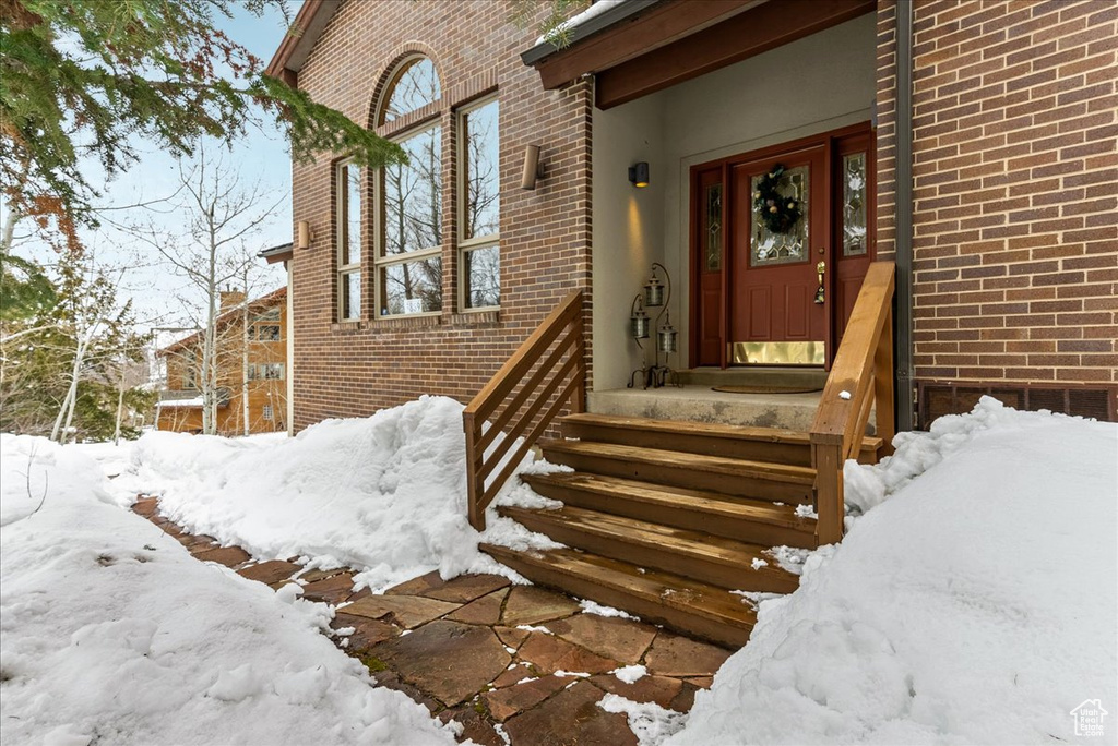 View of snow covered property entrance