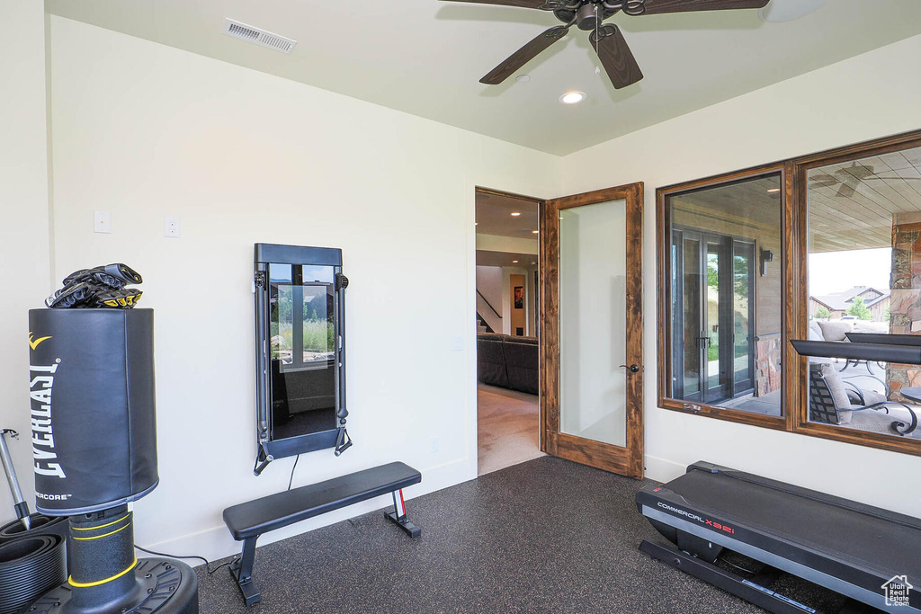 Workout room featuring ceiling fan