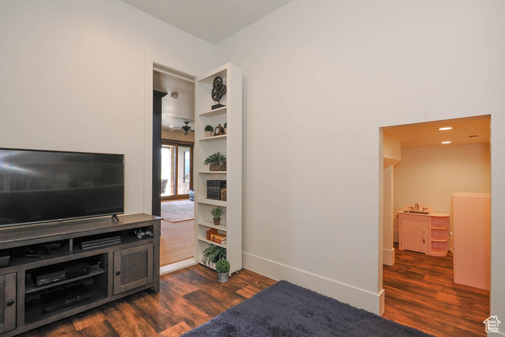 Living room featuring dark hardwood / wood-style flooring and sink