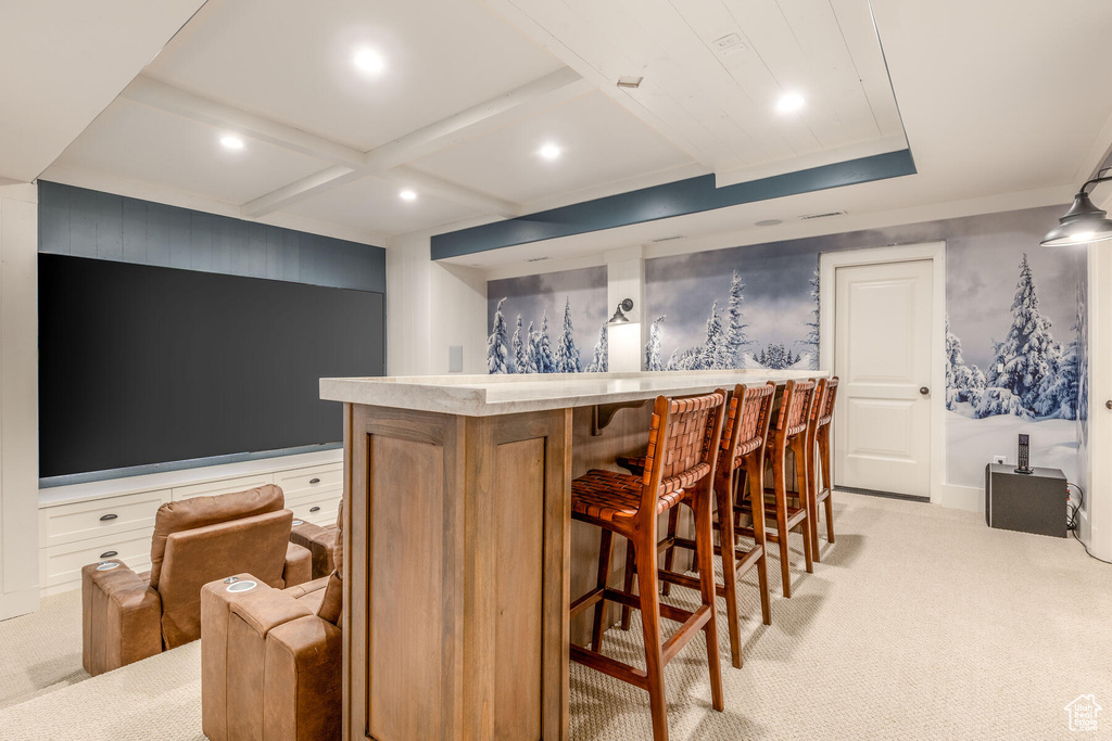 Bar with coffered ceiling and light colored carpet