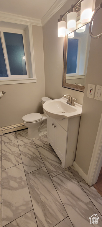 Bathroom featuring crown molding, tile floors, toilet, and vanity