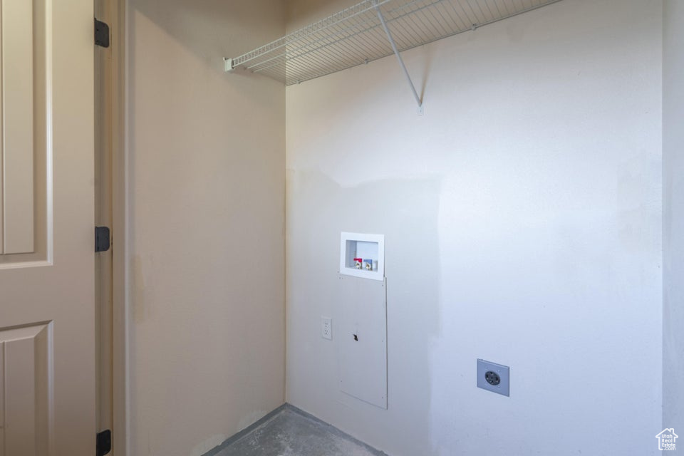 Laundry room with hookup for an electric dryer and hookup for a washing machine
