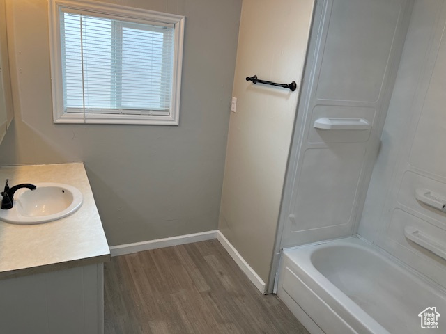 Bathroom featuring vanity and wood-type flooring
