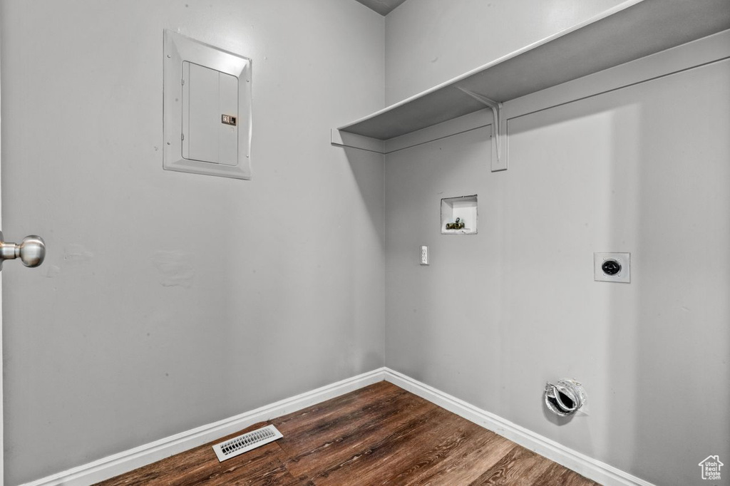 Laundry room with washer hookup, dark hardwood / wood-style flooring, and hookup for an electric dryer