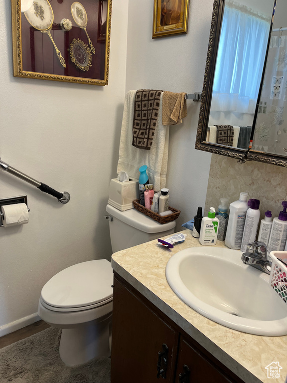 Bathroom with vanity and toilet