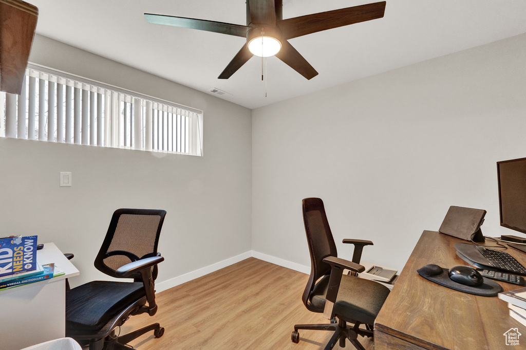 Office featuring light hardwood / wood-style flooring and ceiling fan