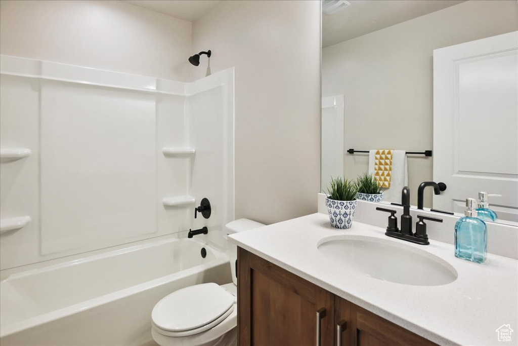 Full bathroom with vanity, toilet, and tub / shower combination