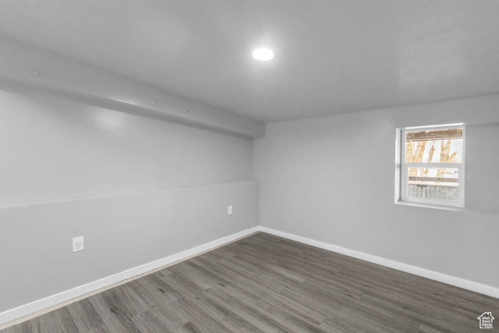 Unfurnished room with dark hardwood / wood-style flooring