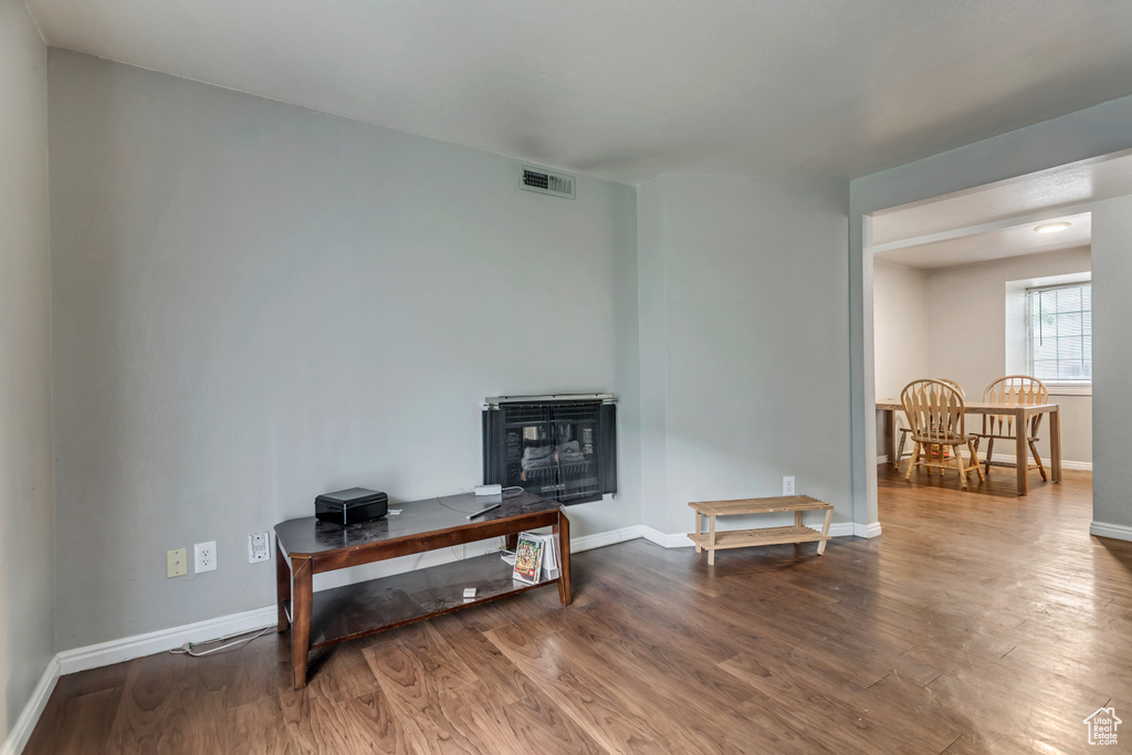 Living area featuring dark wood-type flooring
