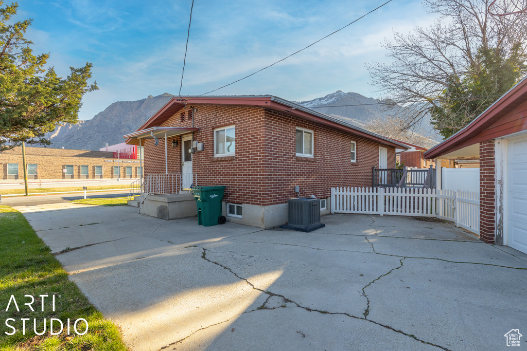 View of home\\\'s exterior with central air condition unit and a mountain view