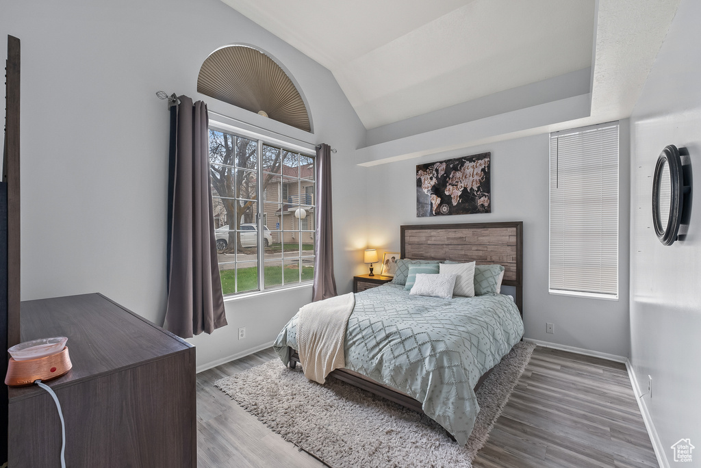 Bedroom featuring vaulted ceiling and light hardwood / wood-style floors