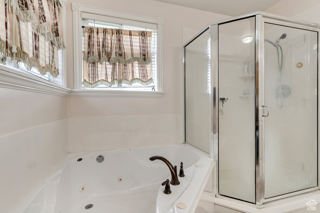 Bathroom with shower with separate bathtub