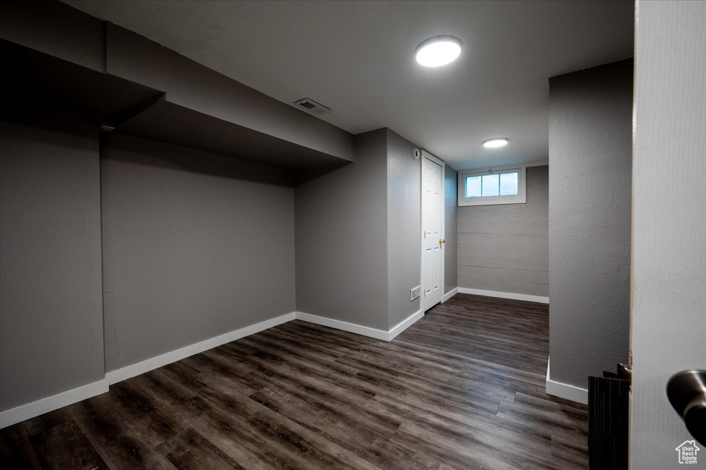Interior space with dark hardwood / wood-style floors