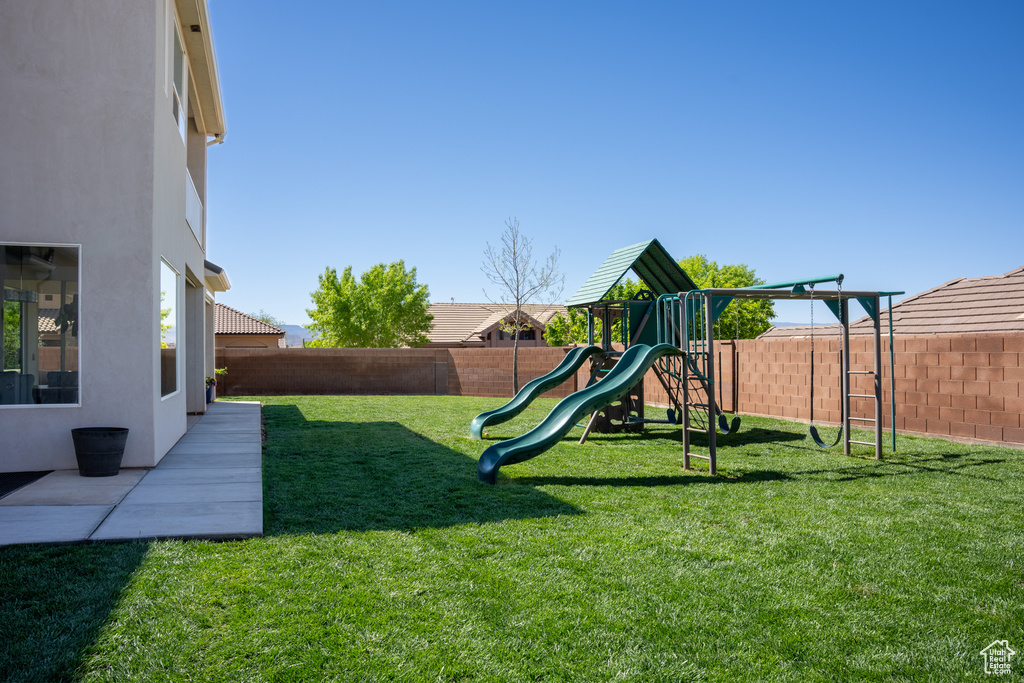 View of play area with a lawn