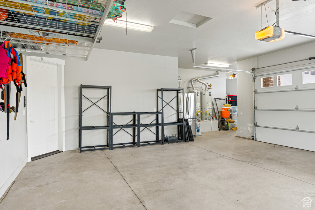 Garage with a garage door opener and water heater