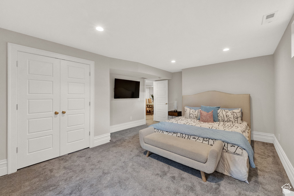 Bedroom with a closet and carpet floors